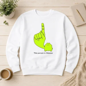 Top This Person Is Chinese Green Frog Pointing Finger Meme sweater in green with printed frog graphic and text