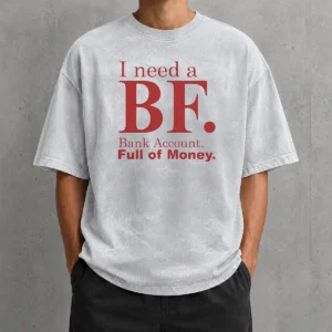 Pretty I Need A BF Bank Account Full Of Money printed on a soft washed t shirt in light gray