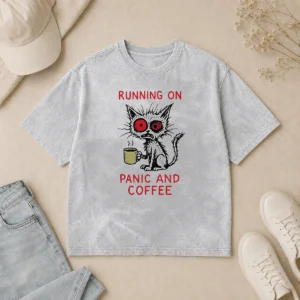 Pretty Running On Panic And Coffee Cat Caffeine design on a soft washed t shirt in light gray