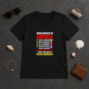 Official Dear Racists In America You Live On Is Native American V Neck Shirt in black showing front graphic and short sleeves