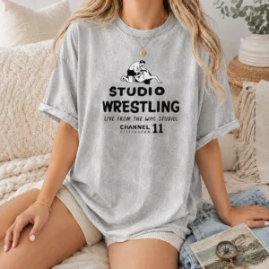 Nice Studio Wrestling Live From The WIIC Studios Channel 11 Pittsburgh printed on a washed t shirt with vintage faded look
