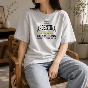 Premium Argentina Champions FIFA World Cup 2026 washed t shirt showing front view in light blue and white colors