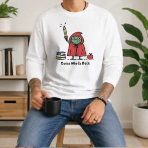Premium Guess WHO Is Back Frog With Pencil And Books Long Sleeve Shirt showing detailed front print on a comfortable long sleeve garment