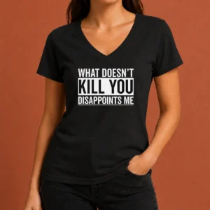 Top Official What Doesn'T Kill You Disappoints Me V Neck shirt in black with bold white text on chest