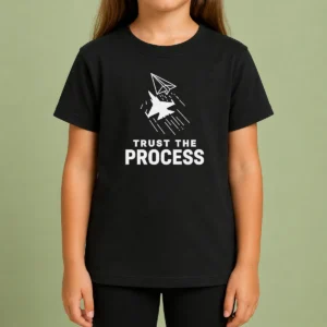 Pretty Official Trust The Process Fighter Jet Paper Airplane Kids T Shirt featuring a fighter jet paper airplane graphic on a children's short sleeve tee