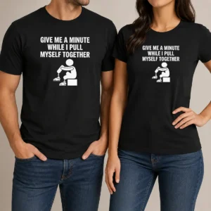 Awesome Give Me A Minute While I Pull Myself Together t shirt in black, front view with bold white text design