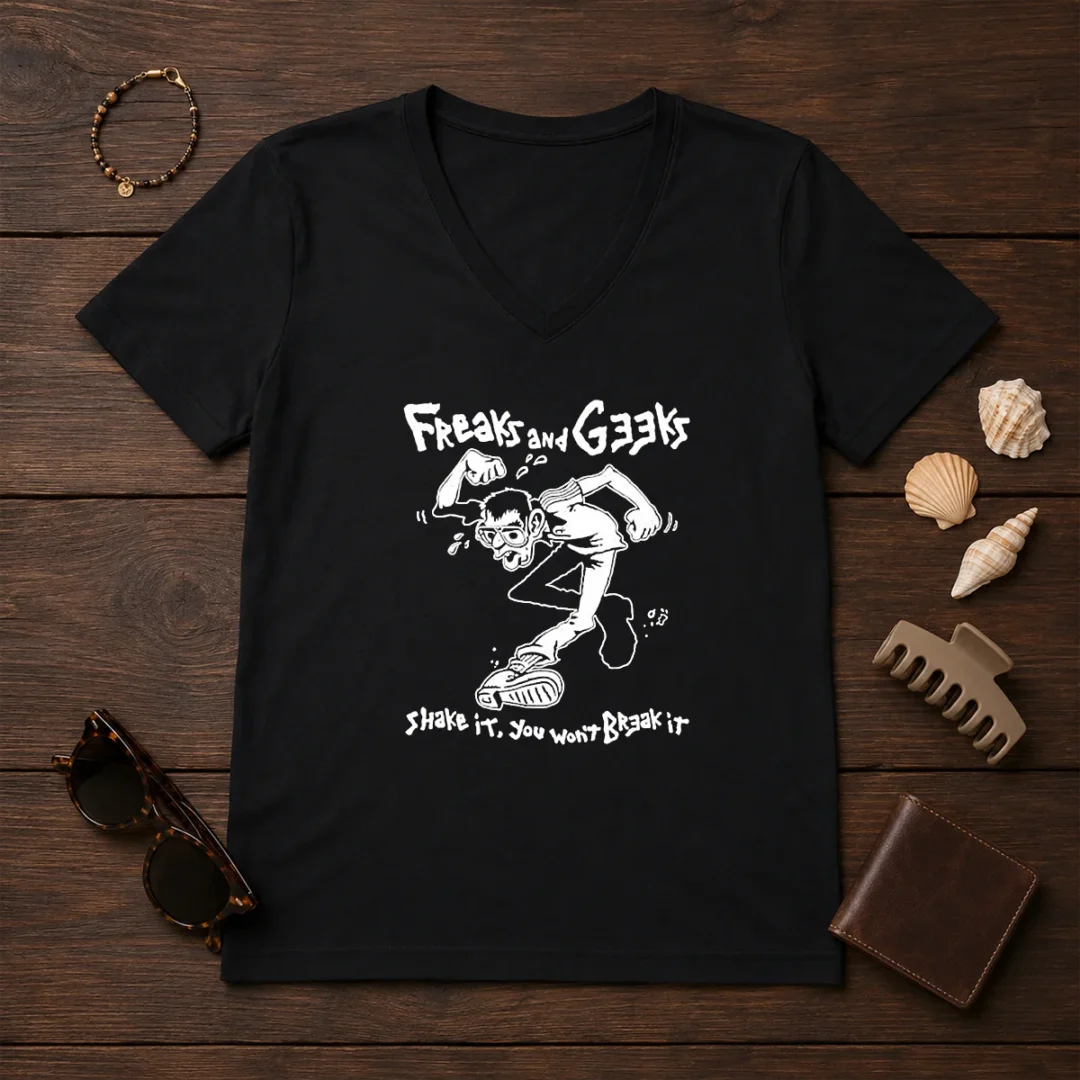 awesome-freaks-and-geeks-shake-it-you-wont-break-it-v-neck Awesome Freaks And Geeks Shake It You Wont Break It V Neck Shirt in dark color with bold graphic print