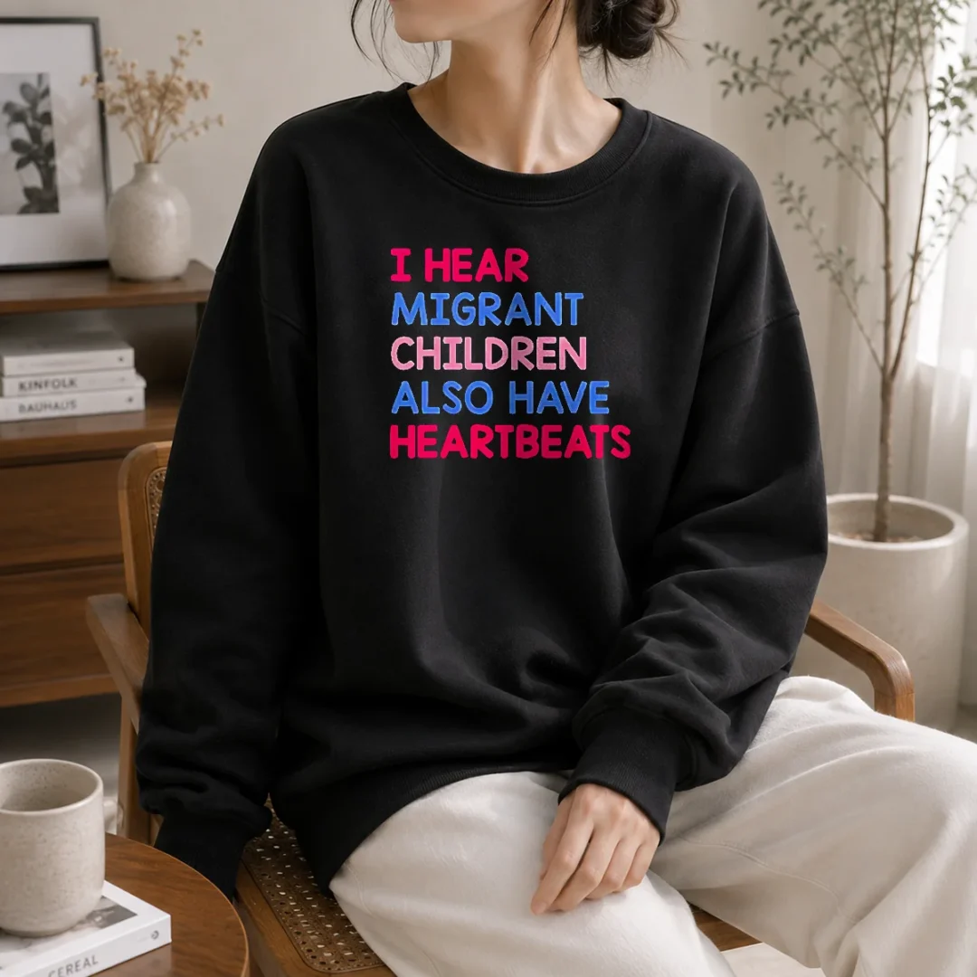awesome-i-hear-migrant-children-also-have-heartbeats-sweater Awesome I Hear Migrant Children Also Have Heartbeats Sweater in cozy knit fabric, displayed on a plain background