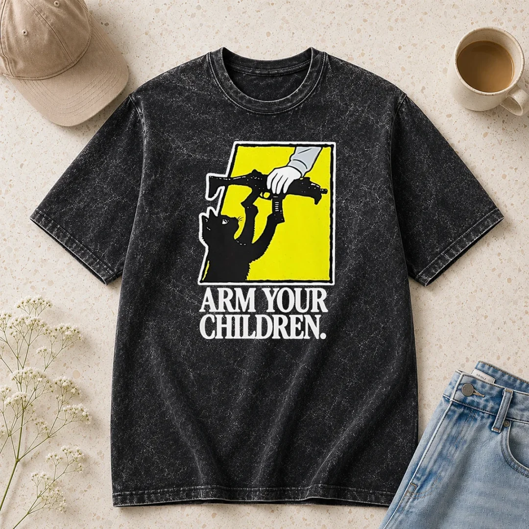 awesome-pretty-black-cat-with-gun-satire-arm-your-children-washed-t-shirt Awesome Pretty Black Cat With Gun Satire Arm Your Children on a black washed t shirt, front view