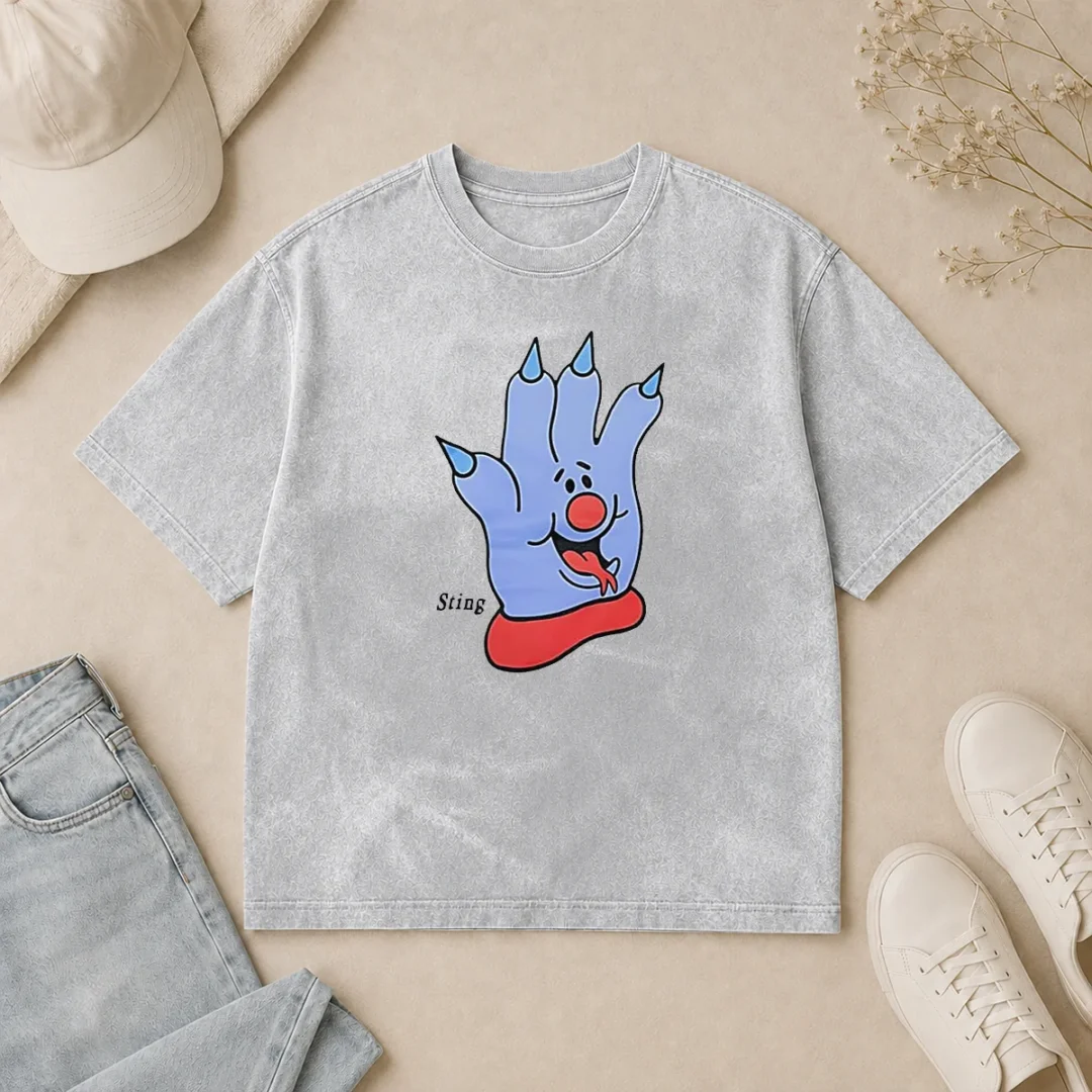 Funny Hot Sting Blue Cartoon Hand Character Mascot Washed T Shirt Funny Hot Sting Blue Cartoon Hand Character Mascot printed on a soft washed t shirt in light gray