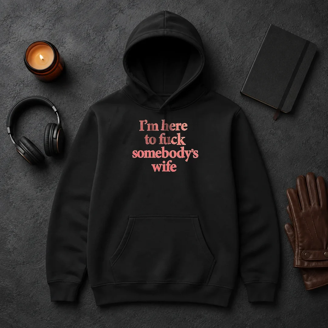 Hot I'M Here To Fuck Somebody'S Wife Hoodie Hot I'M Here To Fuck Somebody'S Wife Hoodie in black, featuring bold white text on front, cozy pullover style with front pocket