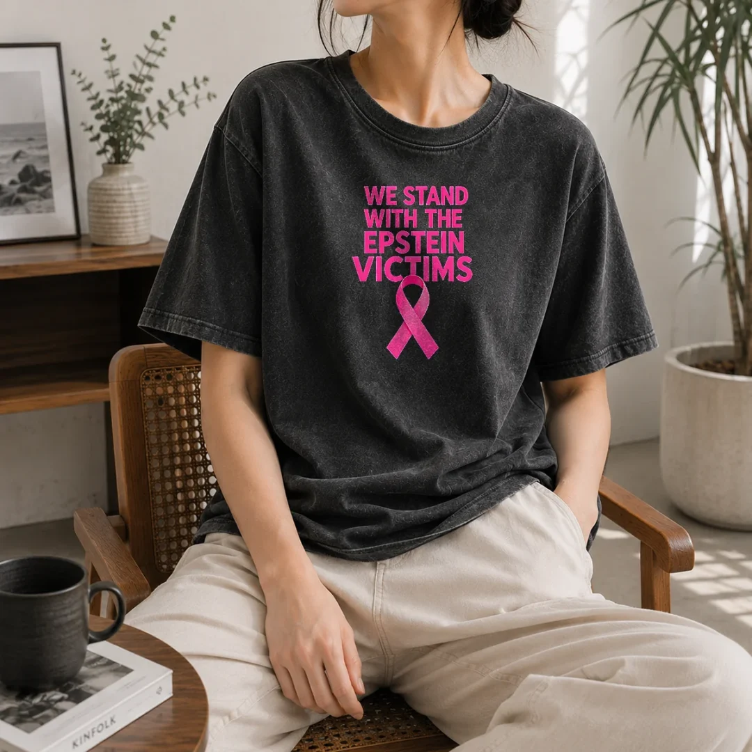 hot-original-we-stand-with-the-epstein-victims-pink-ribbon-washed-t-shirt Hot Original We Stand With The Epstein Victims Pink Ribbon Washed T Shirt in soft pink with clear ribbon graphic