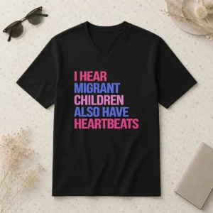 Good I Hear Migrant Children Also Have Heartbeats Bold Statement Text V Neck Shirt in black v neck style