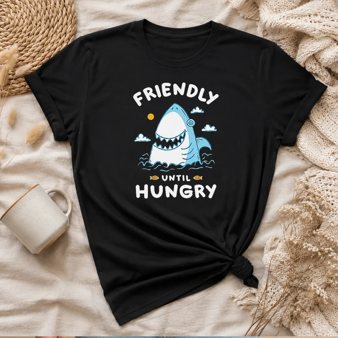 nice-shark-grinning-friendly-until-hungry-t-shirt-1 Nice Shark Grinning Friendly Until Hungry t shirt showing front graphic design on a classic crew neck cotton tee