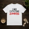 Original I Was Expecting Zombies t shirt in black, featuring bold white text design on front