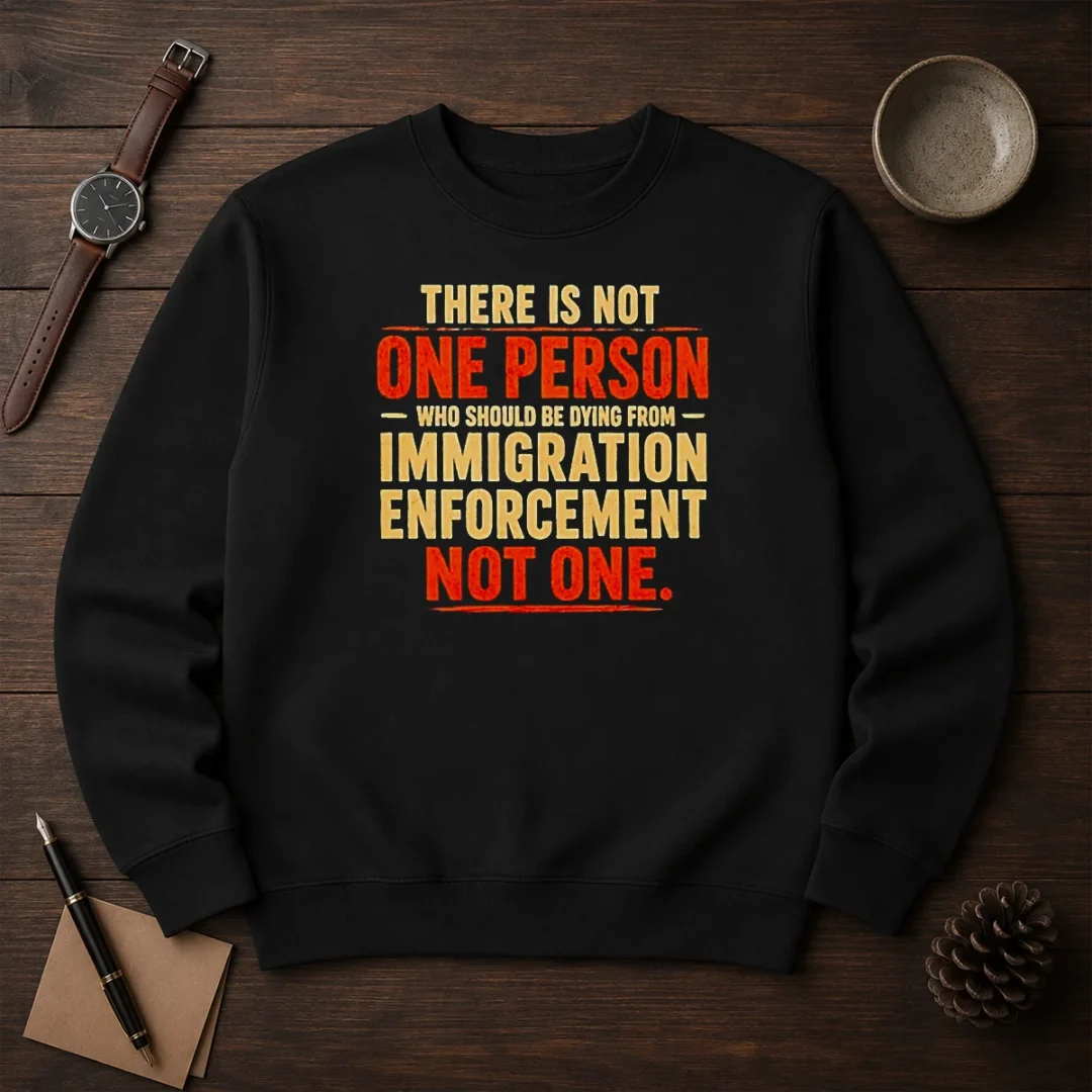 original-there-is-not-one-person-who-should-be-dying-from-immigration-enforcement-sweater-2 Original There Is Not One Person WHO Should Be Dying From Immigration Enforcement sweater in black, crewneck style with bold white text