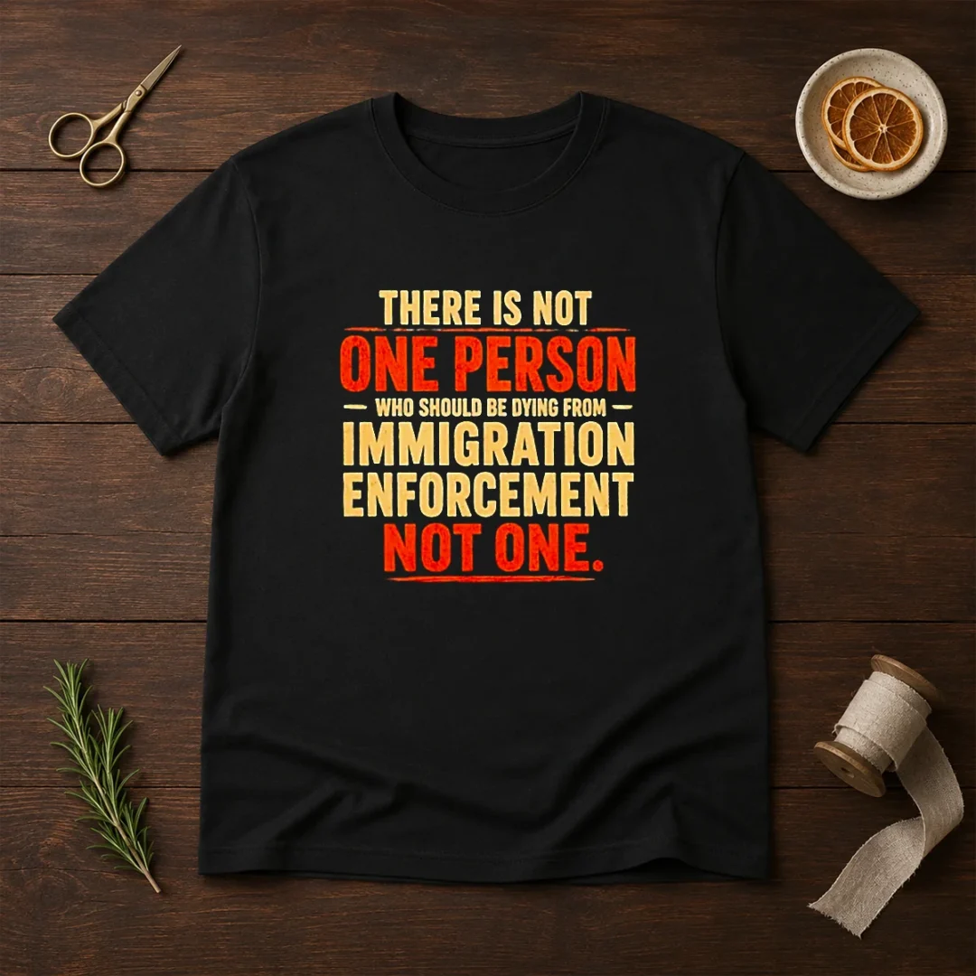 original-there-is-not-one-person-who-should-be-dying-from-immigration-enforcement-t-shirt-2-1 Original There Is Not One Person WHO Should Be Dying From Immigration Enforcement t shirt in black, front view on white background