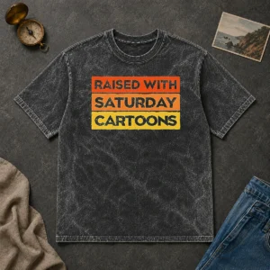 Official Raised With Saturday Cartoons Retro 90s Washed T Shirt in vintage washed fabric with retro 90s print