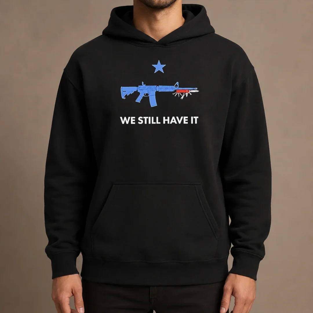 premium-good-we-still-have-it-rifle-and-swiss-army-knife-one-blue-star-hoodie Premium Good We Still Have It Rifle And Swiss Army Knife One Blue Star Hoodie in navy blue, featuring bold graphic print on front