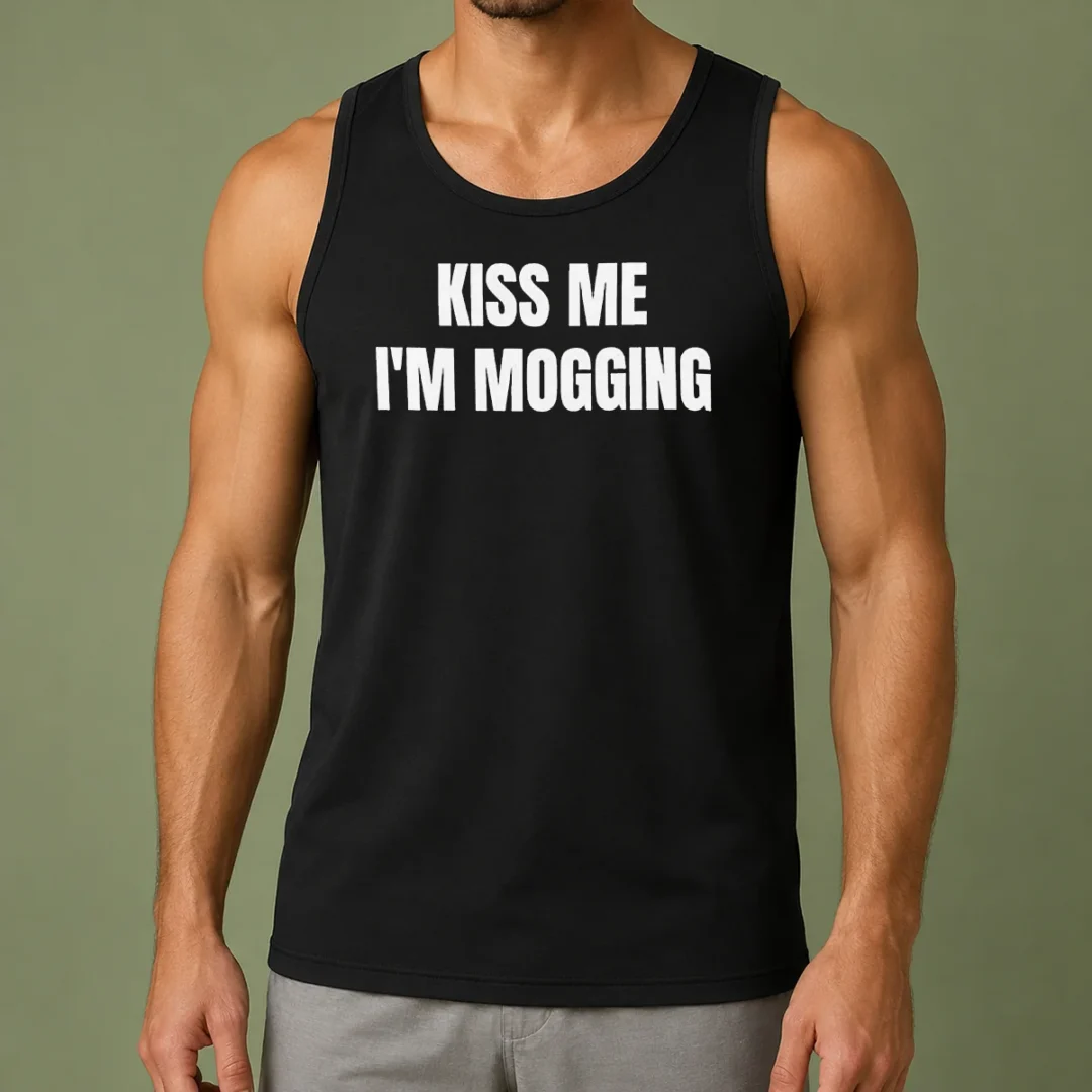 premium-kiss-me-i-m-mogging-looksmaxxing-meme-tank-top-2 Premium Kiss Me I'M Mogging Looksmaxxing Meme tank top in black, sleeveless casual wear with bold white text