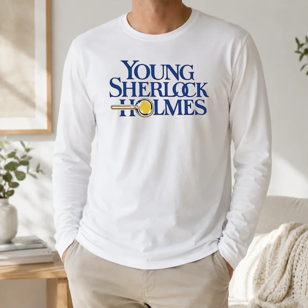 Premium Young Sherlock Holmes Movie Logo 1985 Film Long Sleeve Shirt Premium Young Sherlock Holmes Movie Logo 1985 Film Long Sleeve Shirt in black with classic 1985 movie logo printed on front
