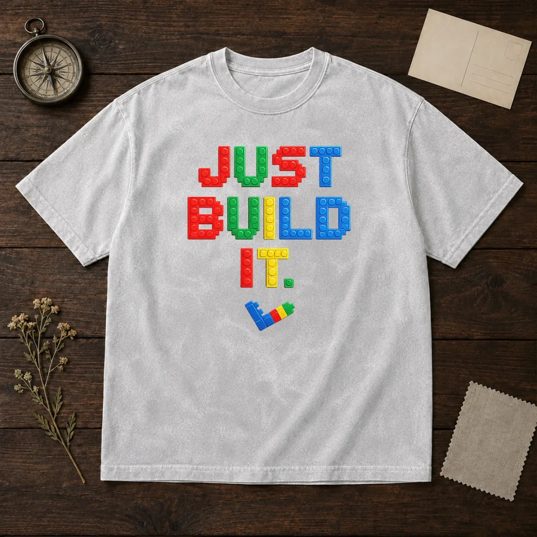 top-just-build-it-master-builder-building-block-washed-t-shirt Top Just Build It Master Builder Building Block design on a soft washed t shirt in neutral tones