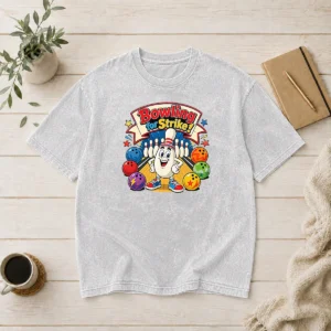 Funny Official Bowling For Strike Cartoon Washed T Shirt featuring a playful bowling graphic on soft, worn fabric