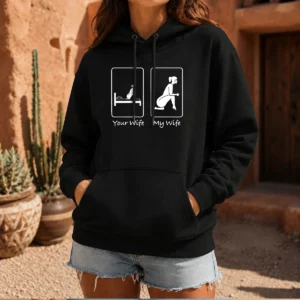 Premium Your Wife Vs My Wife Comparison Humorous Marriage Joke Hoodie in black, front view with printed text design